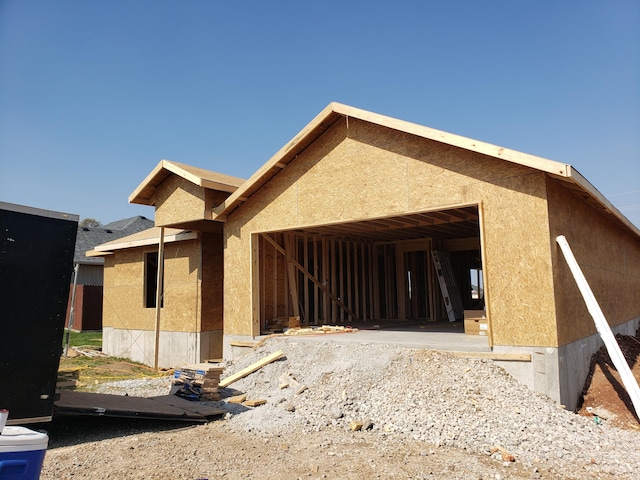 back of property featuring stucco siding