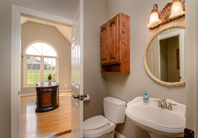1321 E River Oak Dr, Springfield, MO 65803 - bathroom featuring baseboards, toilet, wood finished floors, lofted ceiling, and a sink