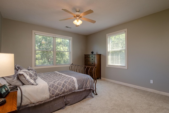 1321 E River Oak Dr, Springfield, MO 65803 - bedroom featuring baseboards, ceiling fan, visible vents, and light carpet