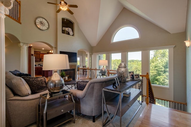 1321 E River Oak Dr, Springfield, MO 65803 - living room with arched walkways, a ceiling fan, decorative columns, and a wealth of natural light
