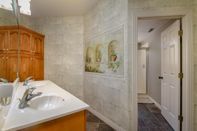 1321 E River Oak Dr, Springfield, MO 65803 - full bath with tile patterned flooring, a sink, a stall shower, and visible vents
