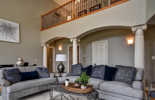 1321 E River Oak Dr, Springfield, MO 65803 - living room featuring ornate columns, arched walkways, and a towering ceiling