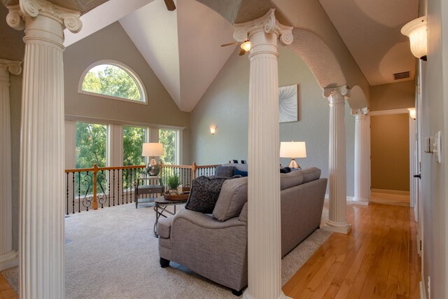 1321 E River Oak Dr, Springfield, MO 65803 - living area with decorative columns, high vaulted ceiling, light wood-style flooring, visible vents, and ceiling fan