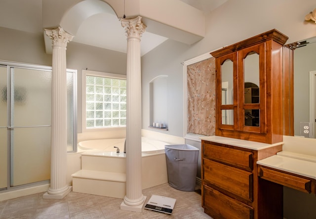 1321 E River Oak Dr, Springfield, MO 65803 - bathroom with a bath, a shower stall, vanity, decorative columns, and tile patterned flooring