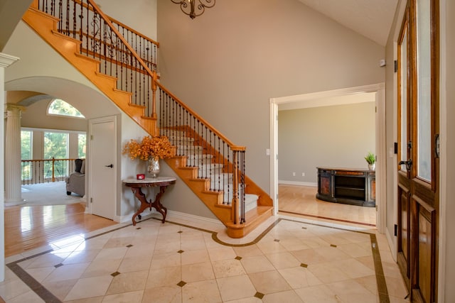 1321 E River Oak Dr, Springfield, MO 65803 - entryway with baseboards, high vaulted ceiling, and decorative columns