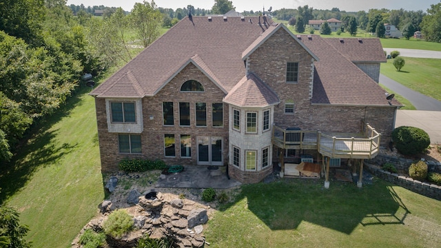 1321 E River Oak Dr, Springfield, MO 65803 - rear view of house with a lawn, brick siding, a deck, and a patio area