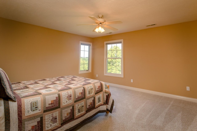 1321 E River Oak Dr, Springfield, MO 65803 - carpeted bedroom with baseboards, visible vents, and a ceiling fan