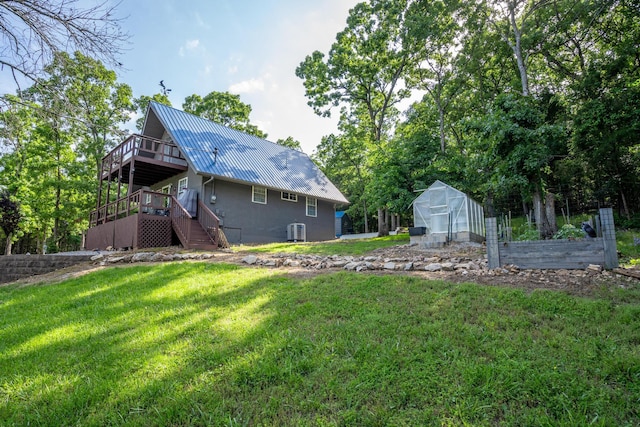645 Buck Run Dr, Branson West, MO 65737 - view of grassy yard with an exterior structure, stairs, a deck, an outdoor structure, and central air condition unit