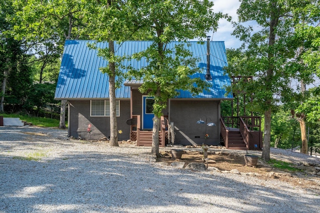 645 Buck Run Dr, Branson West, MO 65737 - view of front of house with metal roof, stairway, a standing seam roof, crawl space, and stucco siding