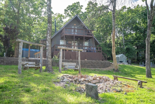 645 Buck Run Dr, Branson West, MO 65737 - rear view of house with a wooden deck, an outbuilding, a lawn, stairs, and a storage shed