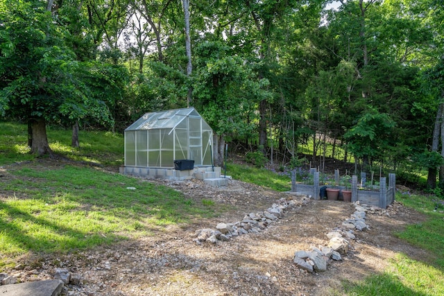 645 Buck Run Dr, Branson West, MO 65737 - view of yard featuring an exterior structure, a vegetable garden, and an outbuilding