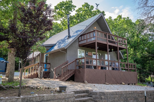 645 Buck Run Dr, Branson West, MO 65737 - rear view of property featuring stairs, stucco siding, metal roof, and a deck