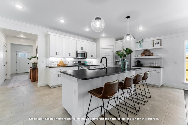 1208 W Pebblebrooke Dr, Ozark, MO 65721 - kitchen featuring white cabinetry, open shelves, stainless steel appliances, a sink, and dark countertops
