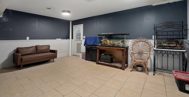 sitting room with tile patterned flooring