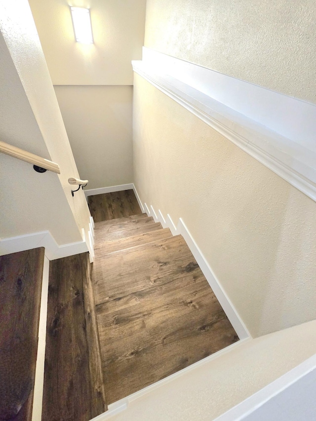 1511 W Lee St, Springfield, MO 65803 - staircase featuring baseboards and wood finished floors