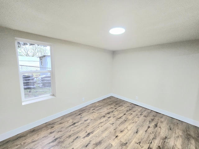 1511 W Lee St, Springfield, MO 65803 - spare room with wood finished floors and baseboards