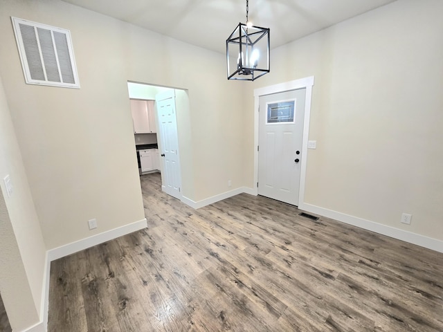 1511 W Lee St, Springfield, MO 65803 - entryway with visible vents, baseboards, light wood-type flooring, and a notable chandelier