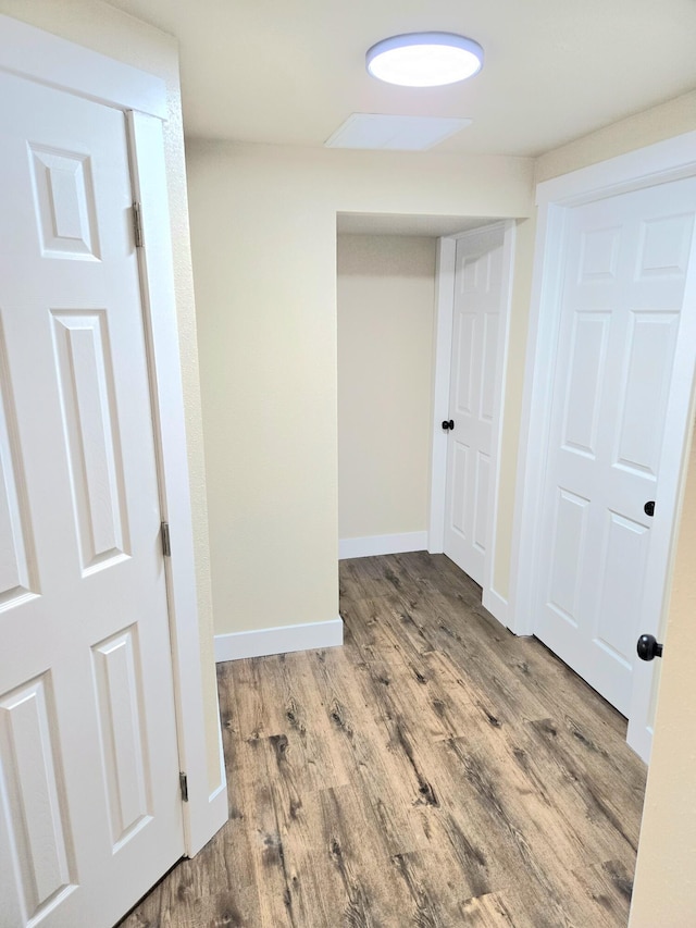 1511 W Lee St, Springfield, MO 65803 - hallway with baseboards and wood finished floors
