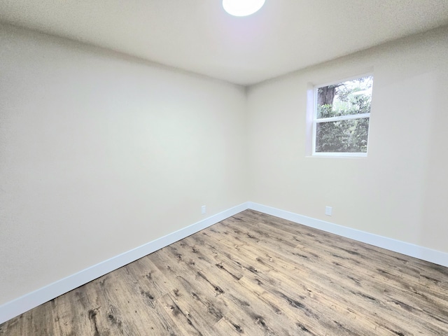 1511 W Lee St, Springfield, MO 65803 - unfurnished room featuring wood finished floors and baseboards