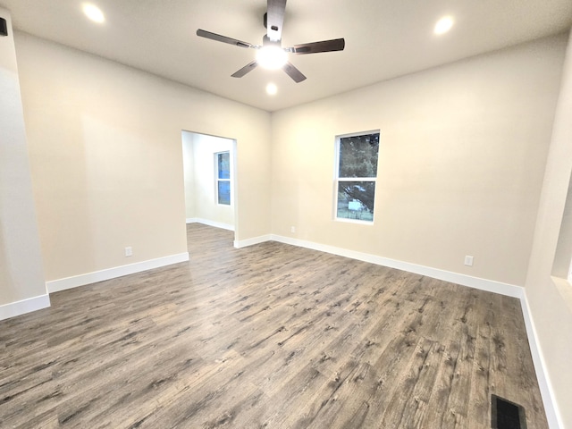 1511 W Lee St, Springfield, MO 65803 - unfurnished room with visible vents, baseboards, a ceiling fan, and wood finished floors