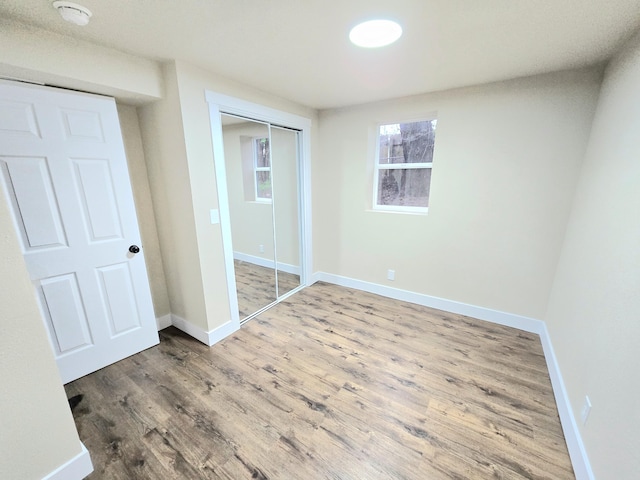 1511 W Lee St, Springfield, MO 65803 - unfurnished bedroom with wood finished floors, baseboards, and a closet
