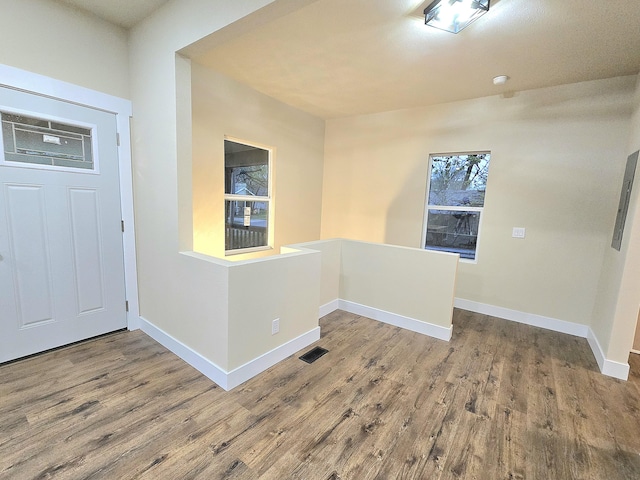 1511 W Lee St, Springfield, MO 65803 - entrance foyer featuring wood finished floors, baseboards, and visible vents