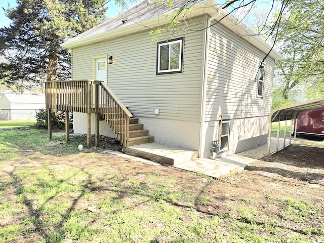 1511 W Lee St, Springfield, MO 65803 - rear view of house featuring stairs, driveway, a detached carport, and fence