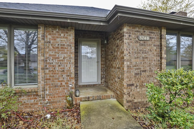 3740 W Glenwood Ct, Springfield, MO 65807 - entrance to property featuring roof with shingles and brick siding