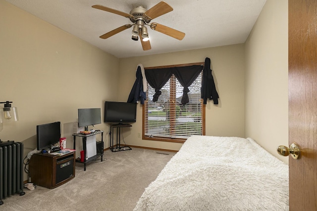 3740 W Glenwood Ct, Springfield, MO 65807 - bedroom with baseboards, radiator heating unit, visible vents, ceiling fan, and carpet
