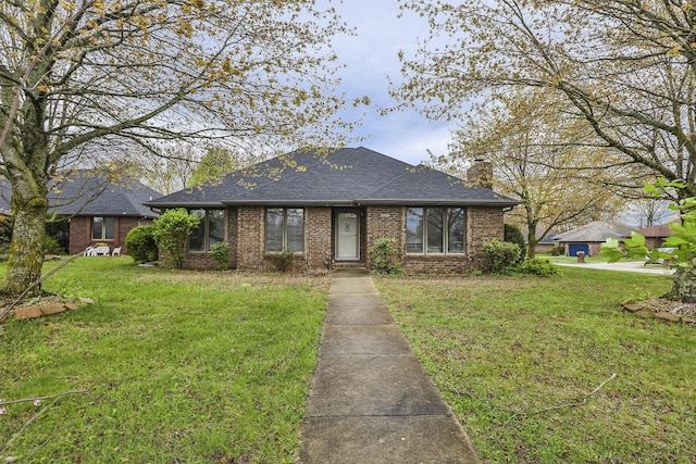 3740 W Glenwood Ct, Springfield, MO 65807 - view of front facade featuring a chimney, a shingled roof, a front yard, and brick siding