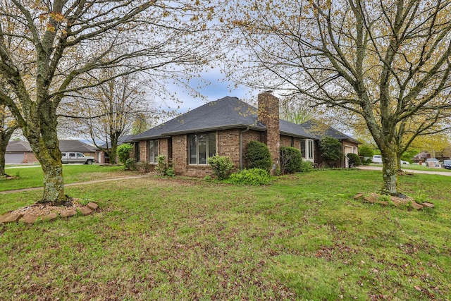 3740 W Glenwood Ct, Springfield, MO 65807 - view of side of property with brick siding, a shingled roof, a lawn, and a chimney