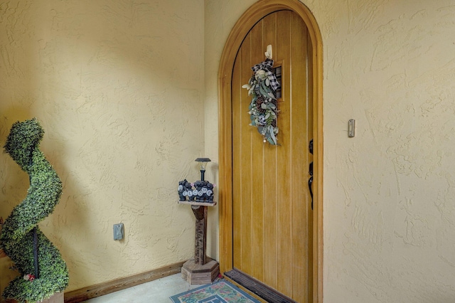 view of exterior entry with stucco siding