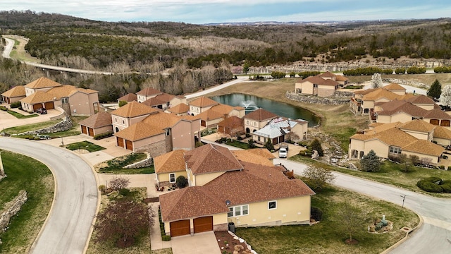 bird's eye view with a water view and a residential view