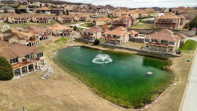 bird's eye view featuring a water view and a residential view