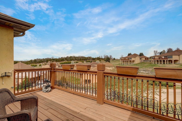 wooden deck with a residential view