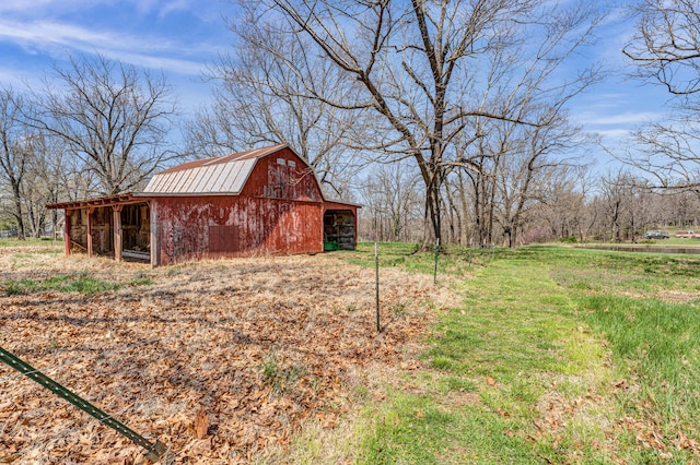 view of yard featuring a barn and an outdoor structure