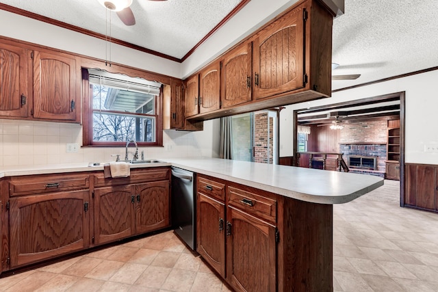 kitchen featuring crown molding, a ceiling fan, a peninsula, and dishwasher