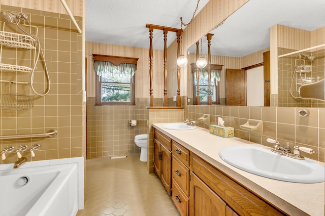 full bath featuring wallpapered walls, a sink, a washtub, and tile walls