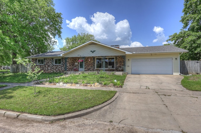 310 W Wishart Dr, Monett, MO 65708 - ranch-style home featuring a garage, concrete driveway, and covered porch