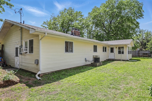 310 W Wishart Dr, Monett, MO 65708 - rear view of property with a chimney and central air condition unit