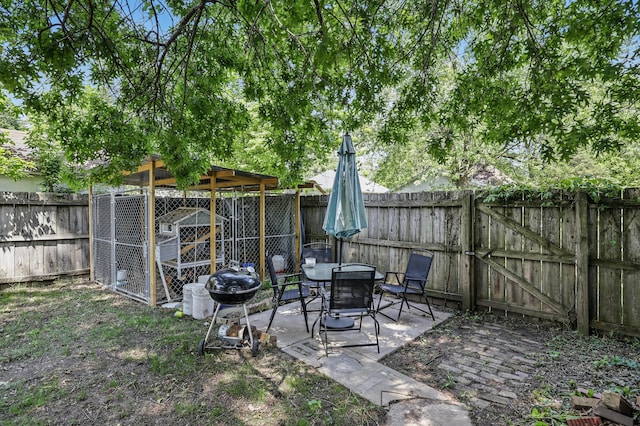 310 W Wishart Dr, Monett, MO 65708 - fenced backyard featuring an outdoor structure and exterior structure