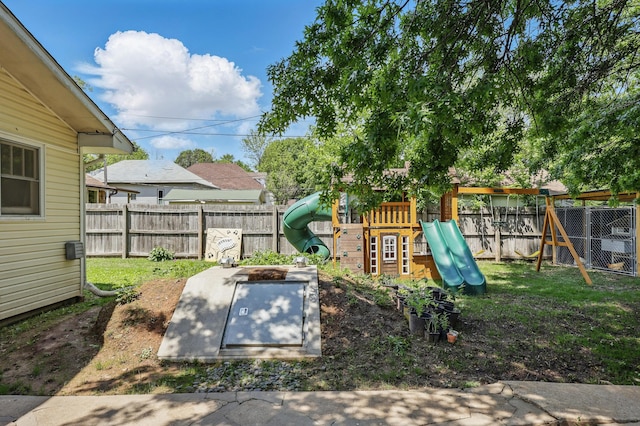 310 W Wishart Dr, Monett, MO 65708 - entry to storm shelter featuring a fenced backyard