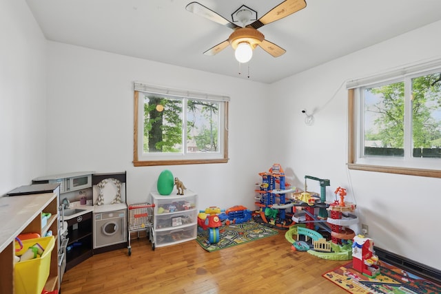 310 W Wishart Dr, Monett, MO 65708 - rec room featuring plenty of natural light, wood finished floors, and a ceiling fan