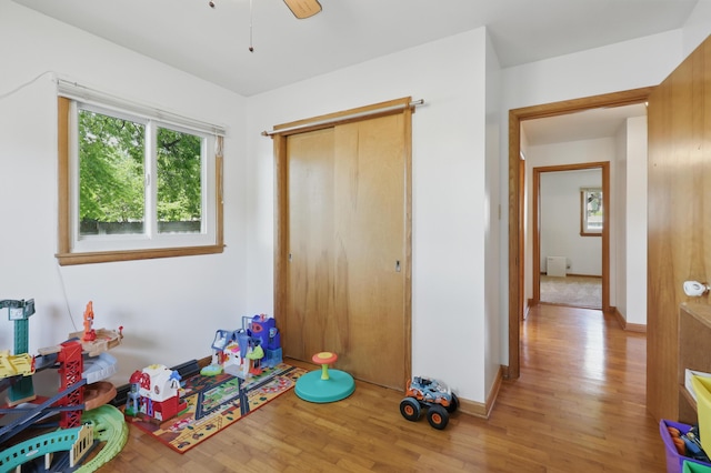 310 W Wishart Dr, Monett, MO 65708 - playroom with wood finished floors, baseboards, and ceiling fan