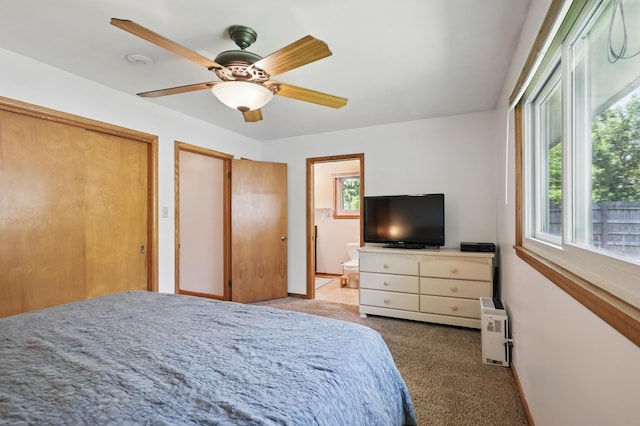 310 W Wishart Dr, Monett, MO 65708 - carpeted bedroom with ceiling fan, connected bathroom, baseboards, and a closet