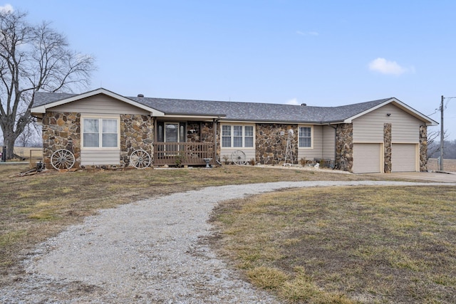 single story home featuring a garage, driveway, stone siding, and a shingled roof