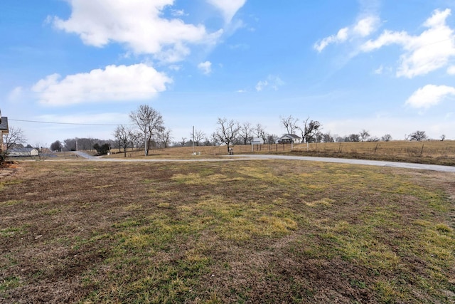 view of yard with a rural view