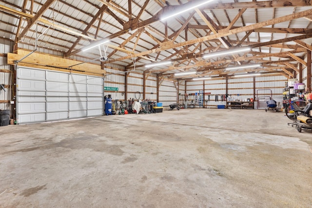 garage with metal wall and a garage door opener