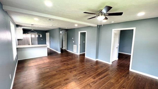 100 E Bond St, Monett, MO 65708 - unfurnished living room with a ceiling fan, visible vents, recessed lighting, dark wood-style flooring, and baseboards