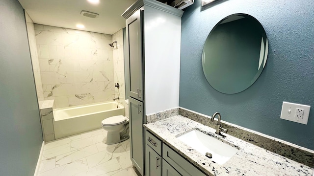 100 E Bond St, Monett, MO 65708 - bathroom featuring vanity, a textured wall, toilet, marble finish floor, and tub / shower combination